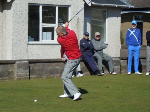 John C tee's off as Champion elect